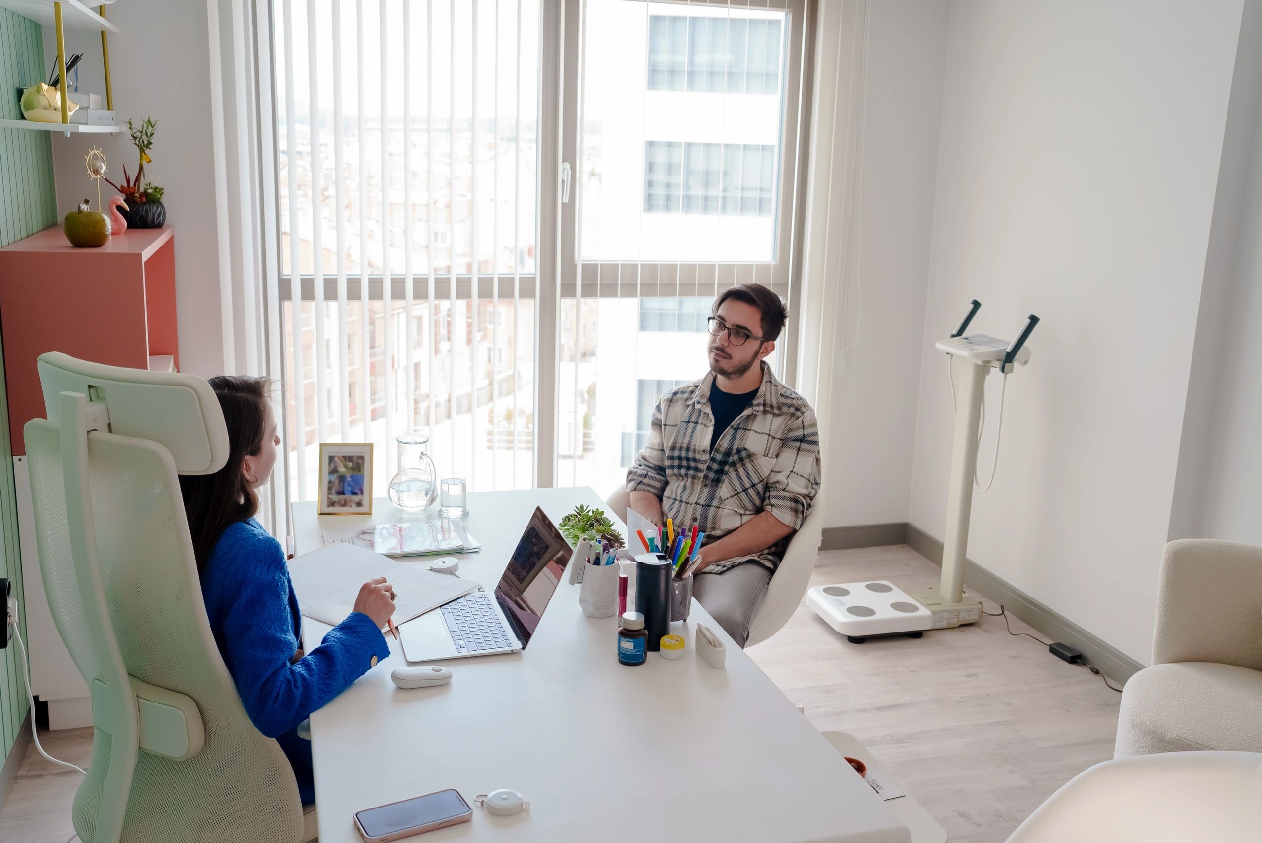 Physician consultation with patient in clinic