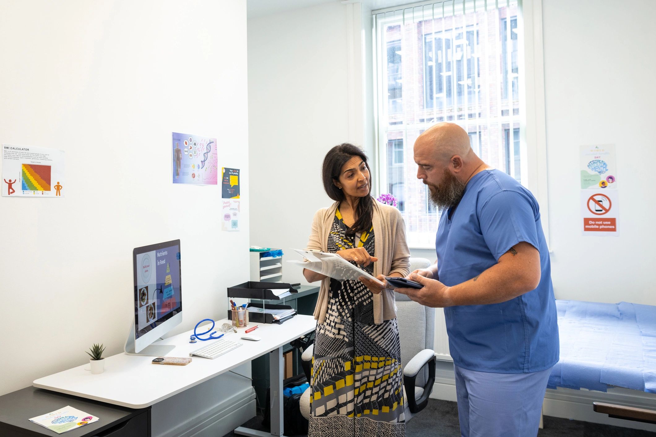 Medical professionals reviewing patient care in a clinic