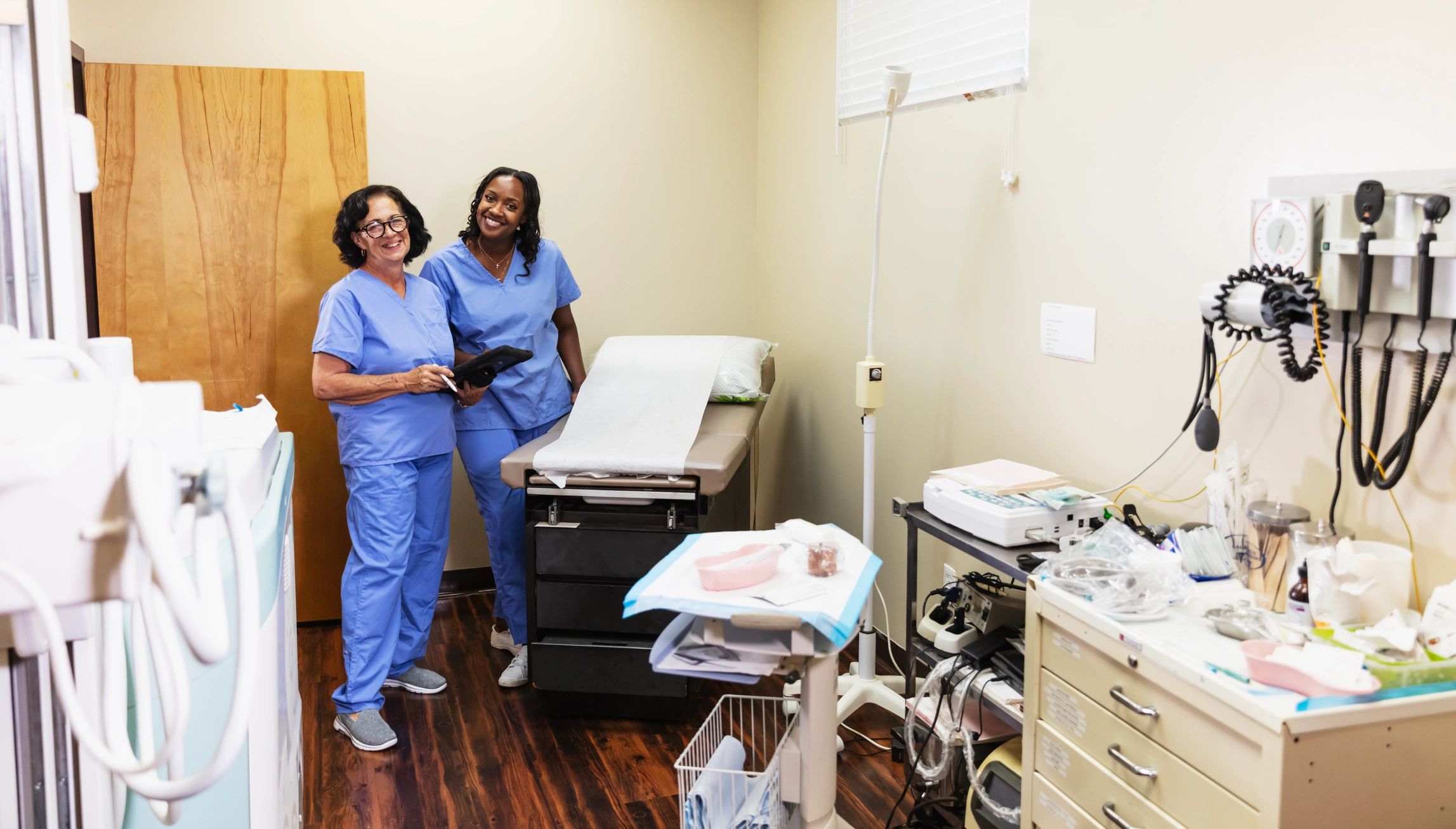 Professional medical team in a modern exam room
