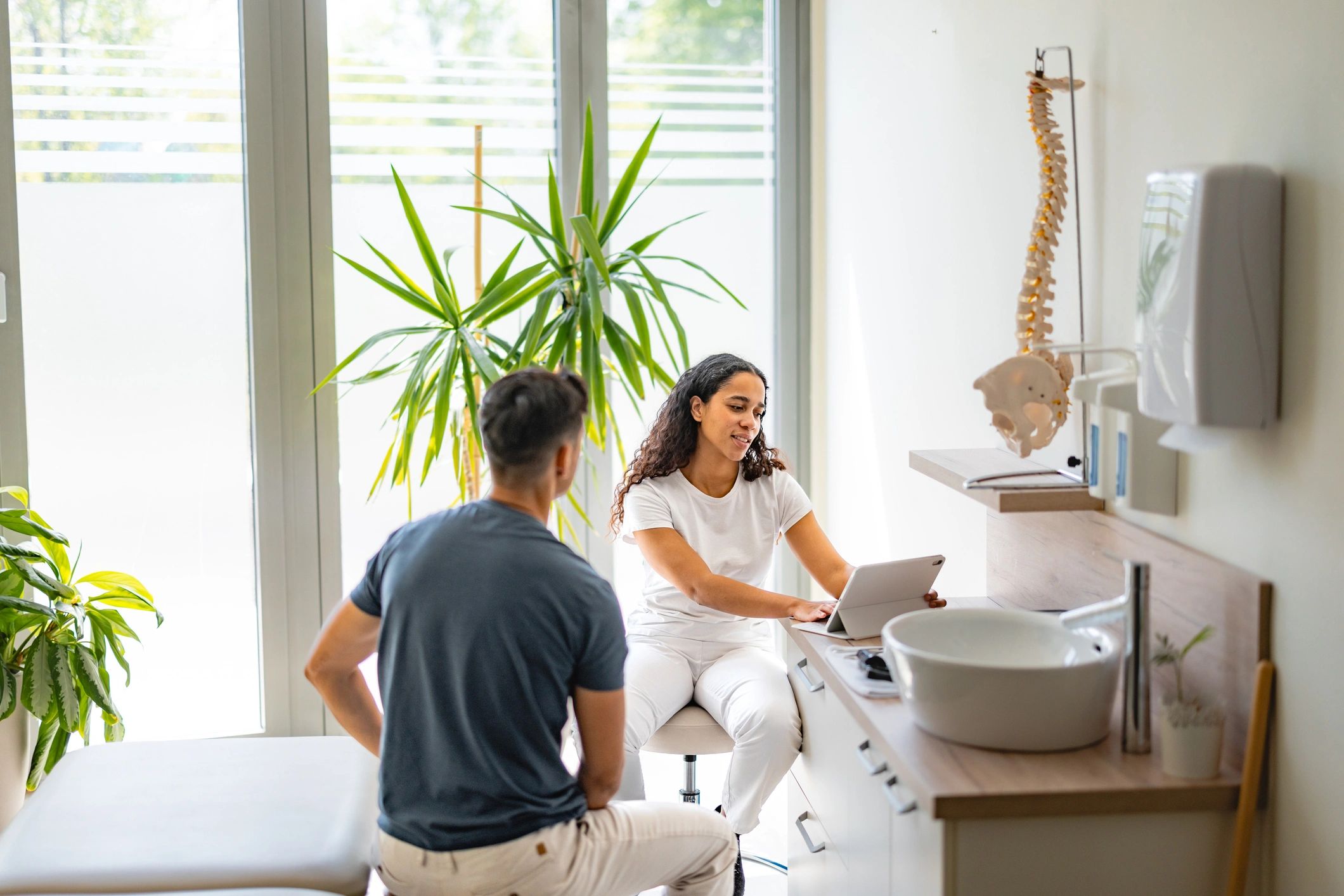 Doctor consulting with a patient in a modern therapy clinic