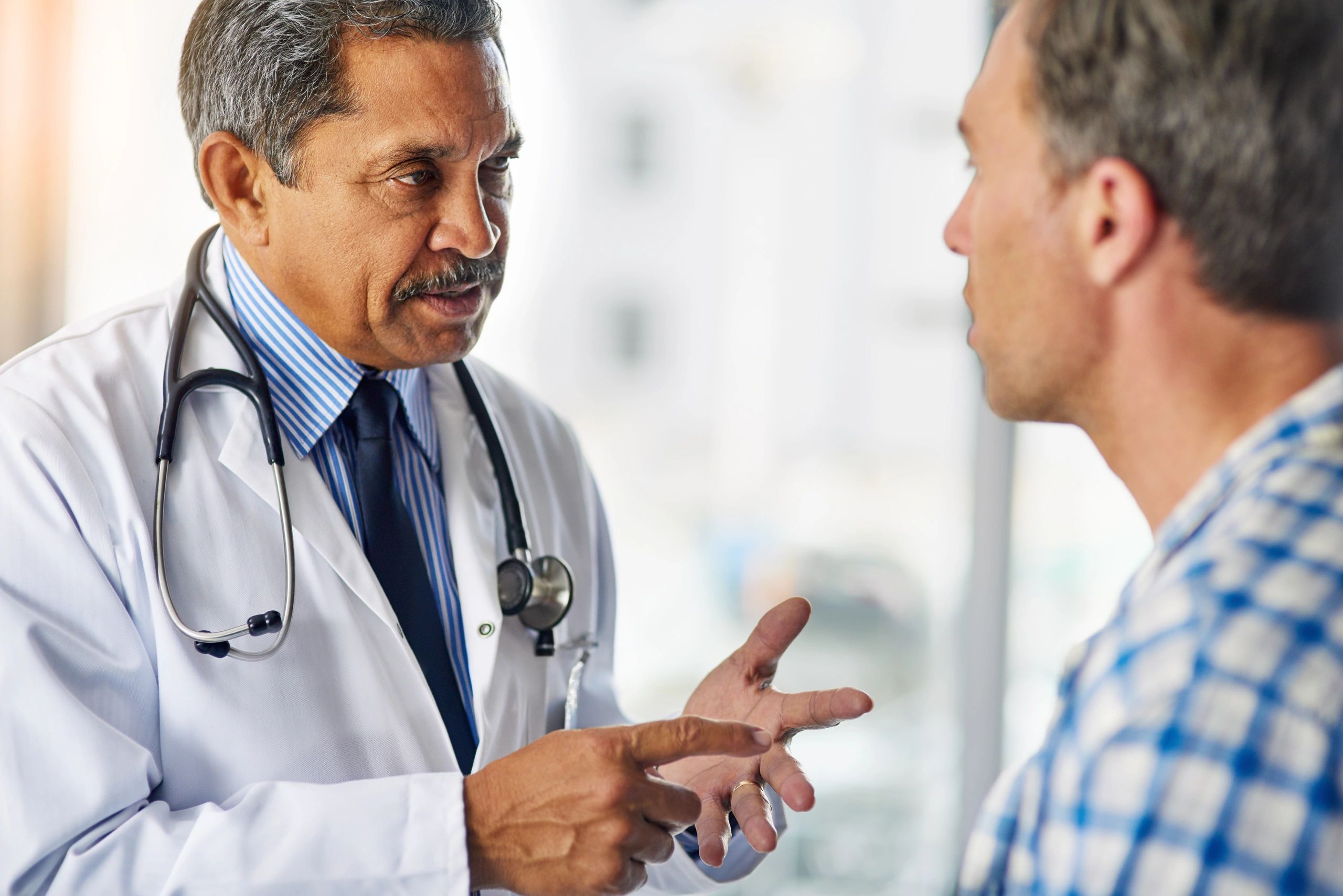 Doctor giving treatment guidance during consultation